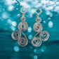 Rhythm in Silver” Spiral Statement Earrings